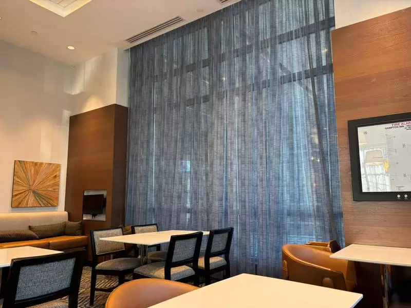 Textured Blue Sheer Curtains in Hotel Interior